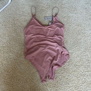 Gaze light pink body suit. New with tags
